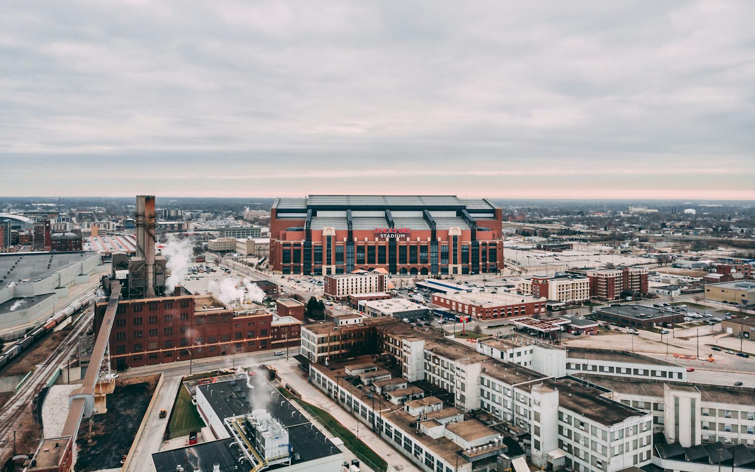 Aerial view of downtown Indianapolis buildings and Lucas Oil Stadium